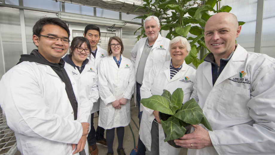 Researchers standing the lab.