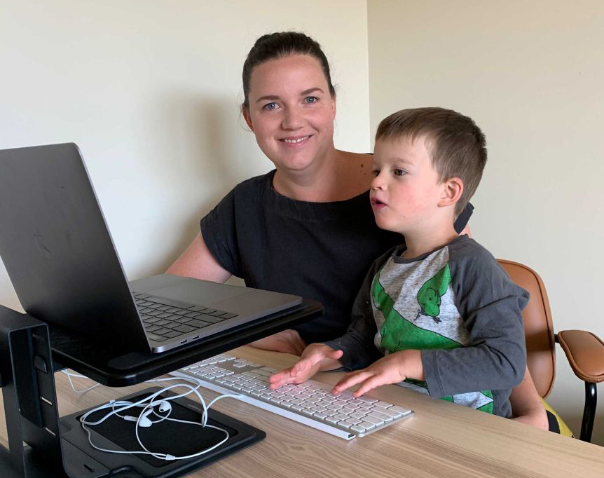 ANU biologist Dr Tory Clarke, pictured with her son Isaac, now works from home. (Supplied)