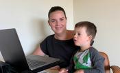 ANU biologist Dr Tory Clarke, pictured with her son Isaac, now works from home.