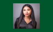 Emily Campos profesional headshot with a green background.